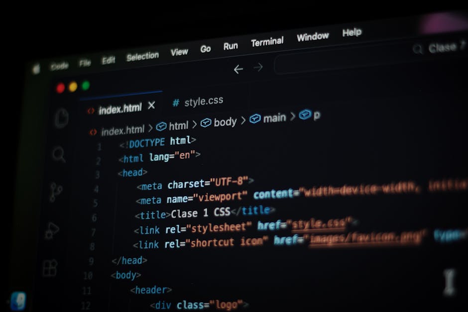 A computer screen displaying lines of HTML and CSS code in a dark-themed code editor, with syntax highlighting in various colors such as blue, orange, and white. The code includes elements like '<html